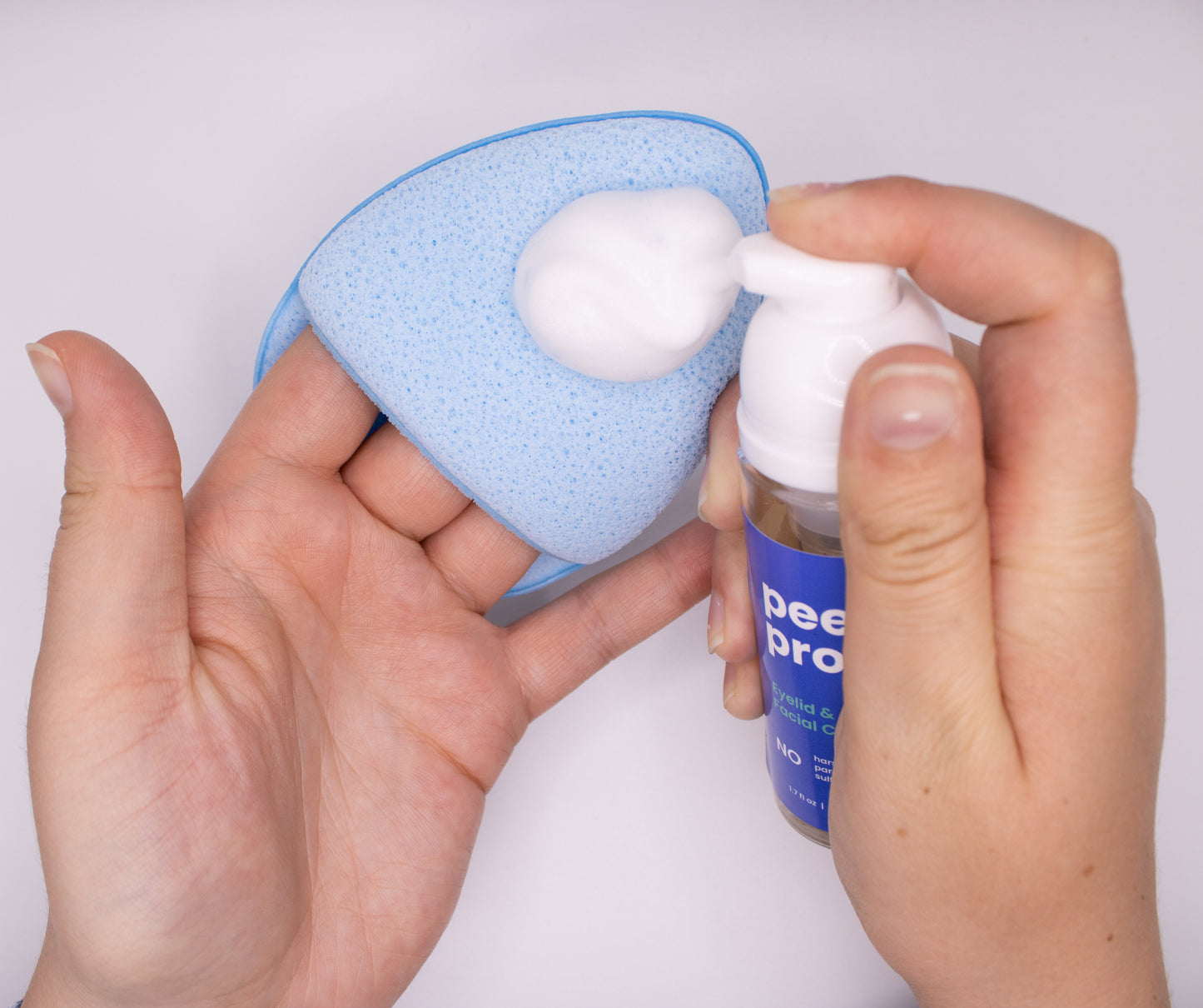 bishop sponge and Peeq foaming cleanser in use against a white background