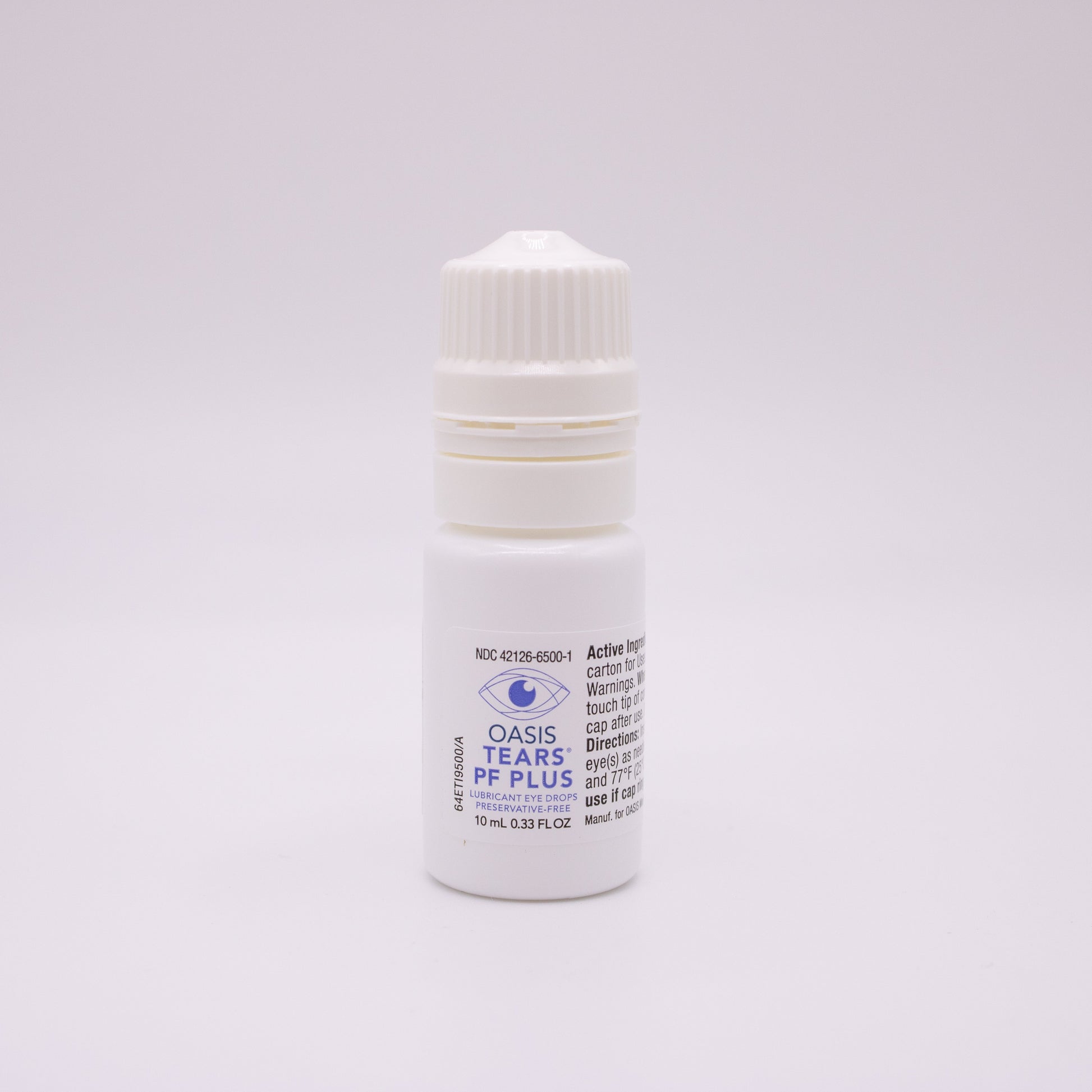 Oasis Tears PF Plus lubricant eye drops bottle with a label on a light gray background