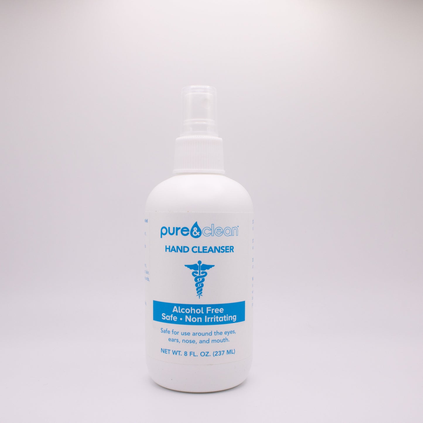 White bottle of purell hand cleaner on a gray background