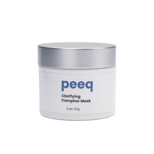A jar of Peeq Clarifying Camphor Masque, 2 oz size, with a label that includes the product name and branding.
