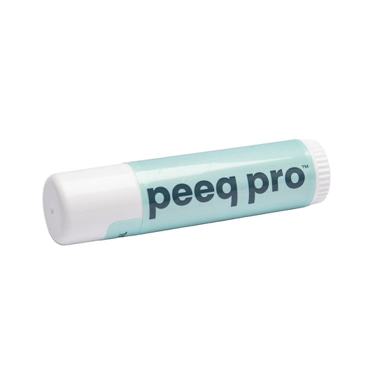 A mineral sunscreen stick with the brand name 'peeq pro' printed on it.