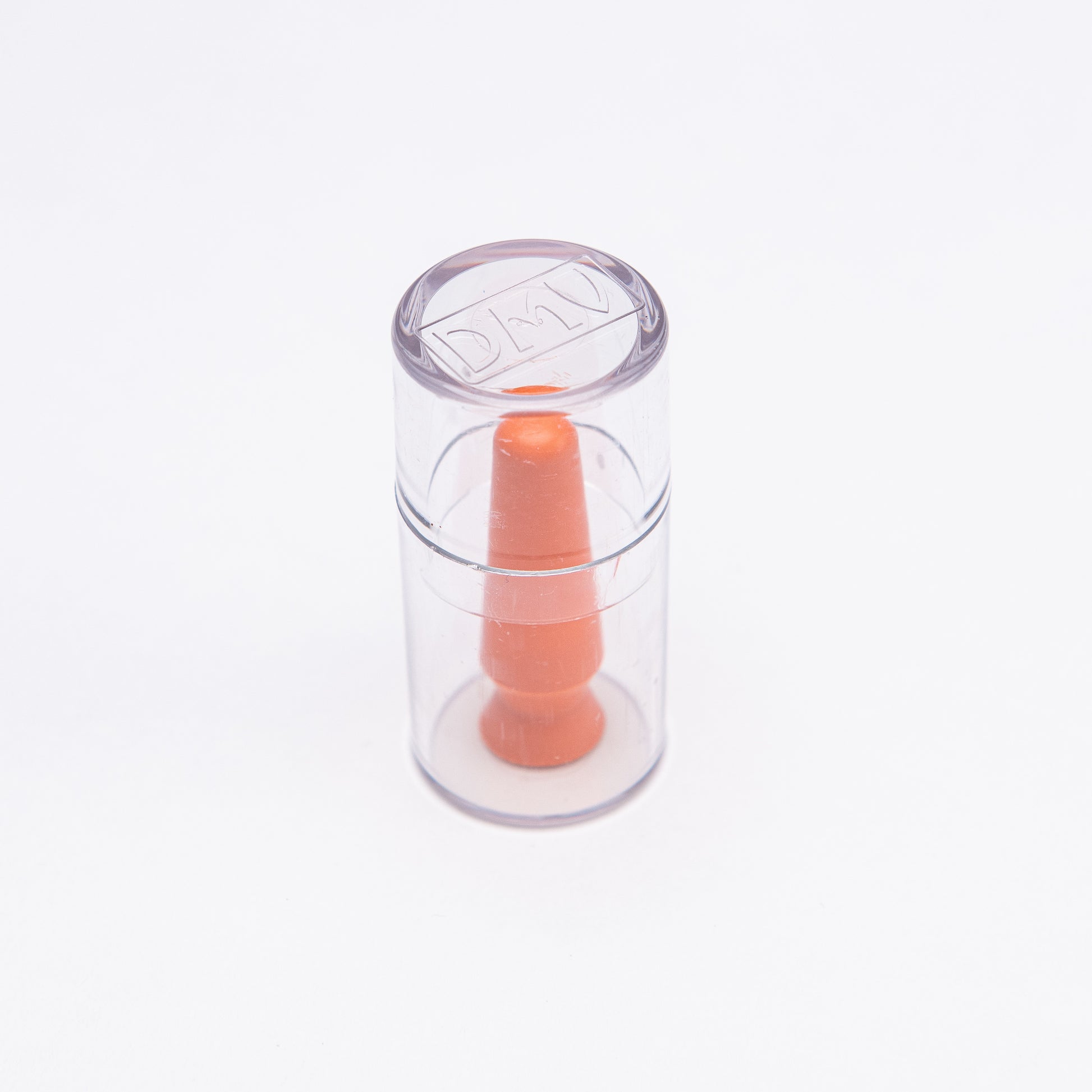 A clear scleral cup with an orange tip used for inserting scleral lenses, hybrid lenses, and soft contact lenses, or for prosthetic eyes.