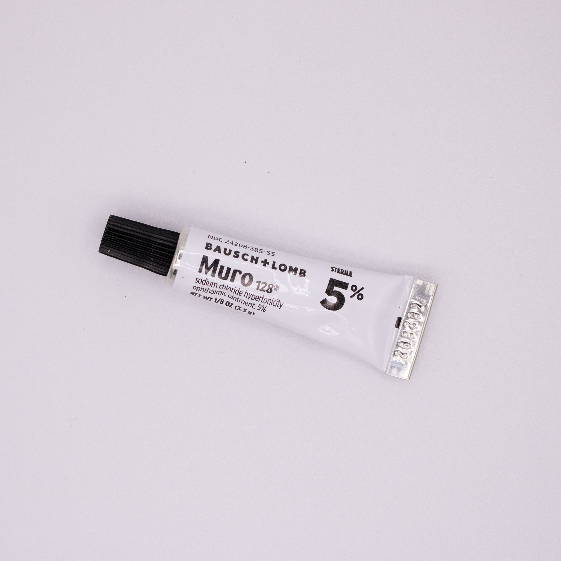 Bausch & Lomb Muro 128 eye drop tube on a white background