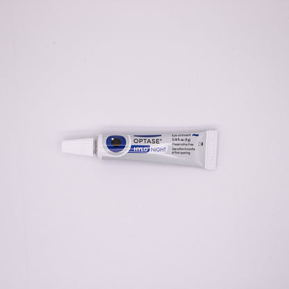 Optase eye drop tube on a white background