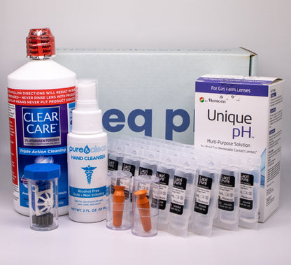 Collection of eye care products including bottles and boxes on a gray background