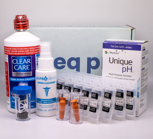 Collection of eye care products including bottles and boxes on a gray background
