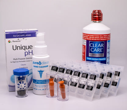 Collection of eye care products including a box labeled 'Unique pH', a bottle of 'Clear Care', and other related items on a white background.