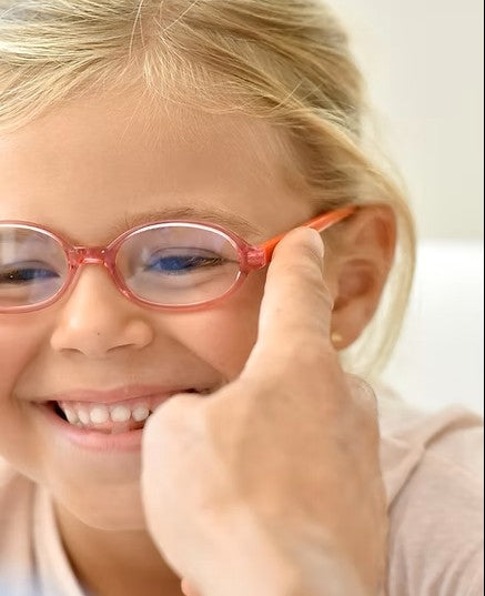 myopia-institute-of-nova-child-trying-glasses.jpg