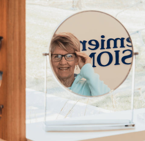 premier-vision-patient-trying-glasses-mirror.webp