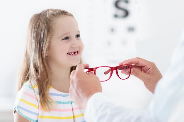 rebuck-and-associates-pediatrics-child-trying-glasses.jpg